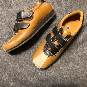 Flat brown and  dark brown bowling style shoe
